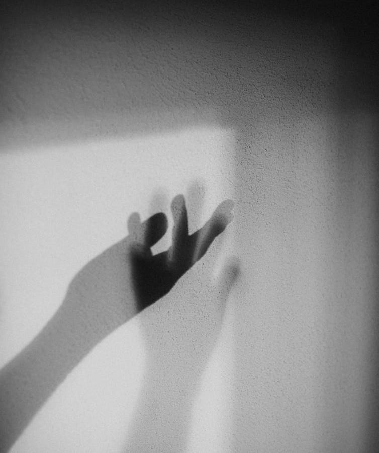 Two slightly transparent, disembodied hands.